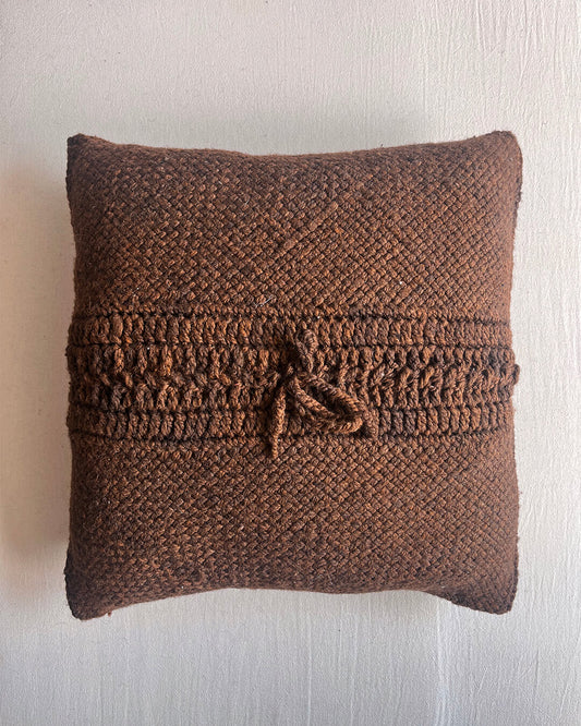 Chocolate Brown square wool cushion, shown from the back with woolen tie closure.