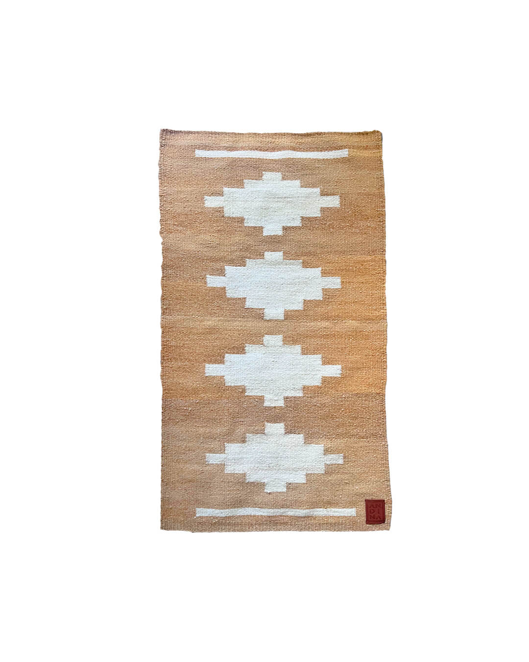 Handwoven CHACO Mini Rug in natural llama fiber with white geometric figures on a warm brown background.