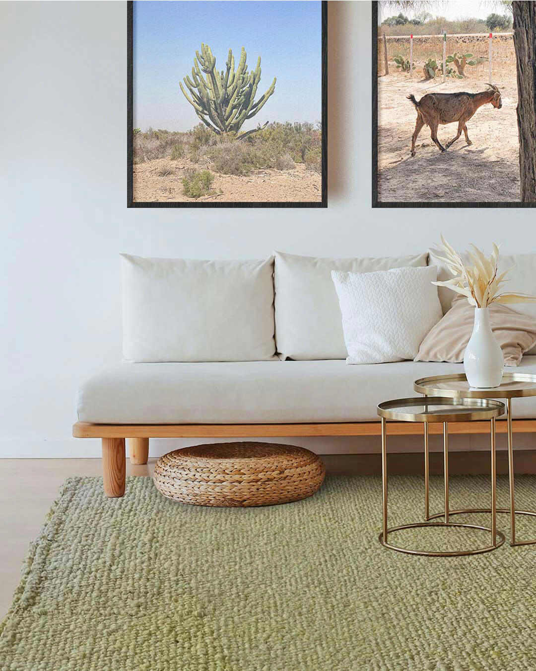 Handwoven wool area rug in yerba green tone styled in a living room with a white sofa, brass side tables, and framed desert landscape artwork.