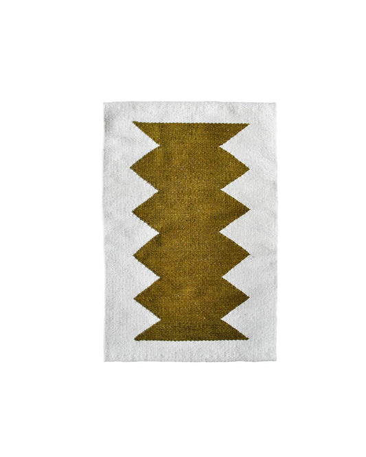 Handwoven CHACO Mini Rug featuring an olive green geometric pattern on a natural wool background.