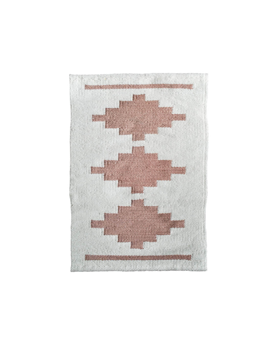 Handwoven CHACO Mini Rug featuring three terracotta geometric motifs on a natural white wool base.